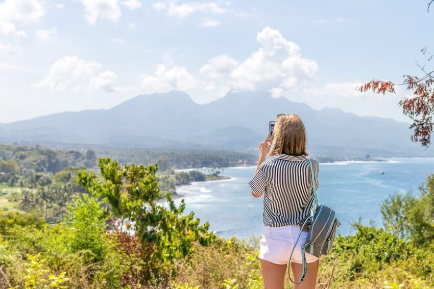 Woman Taking a Photo of the Sceneries