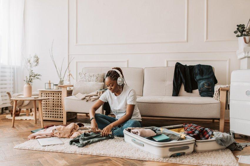 Women Packing Her Clothes for a Trip