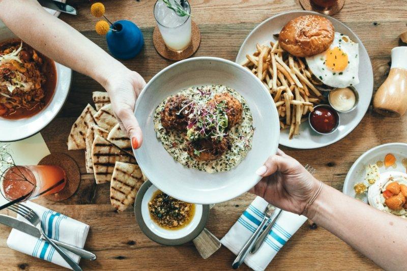 Person Holding A Plate With Food