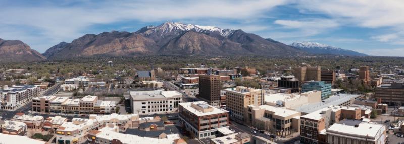 Ogden, Utah aerial panorama with Wasatch Mountains in distance.