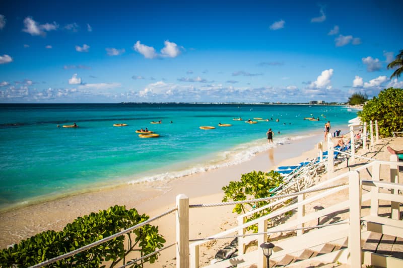 Caymand Islands beach resort with white sand and teal water.