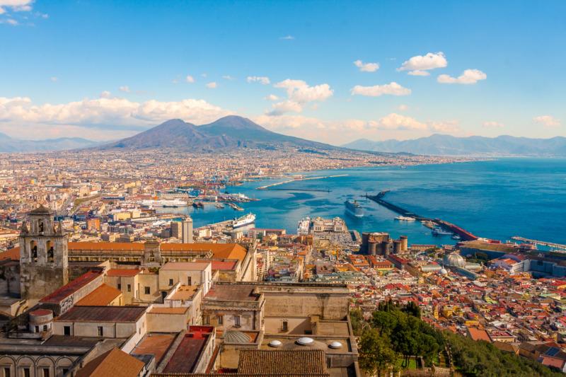 Aerial view of the cityscape of Naples, Italy with Mount Vesuvius in the background