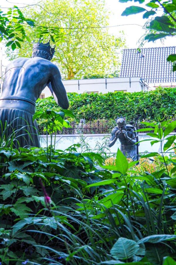 Statues in Andaz Amsterdam's lush garden oasis