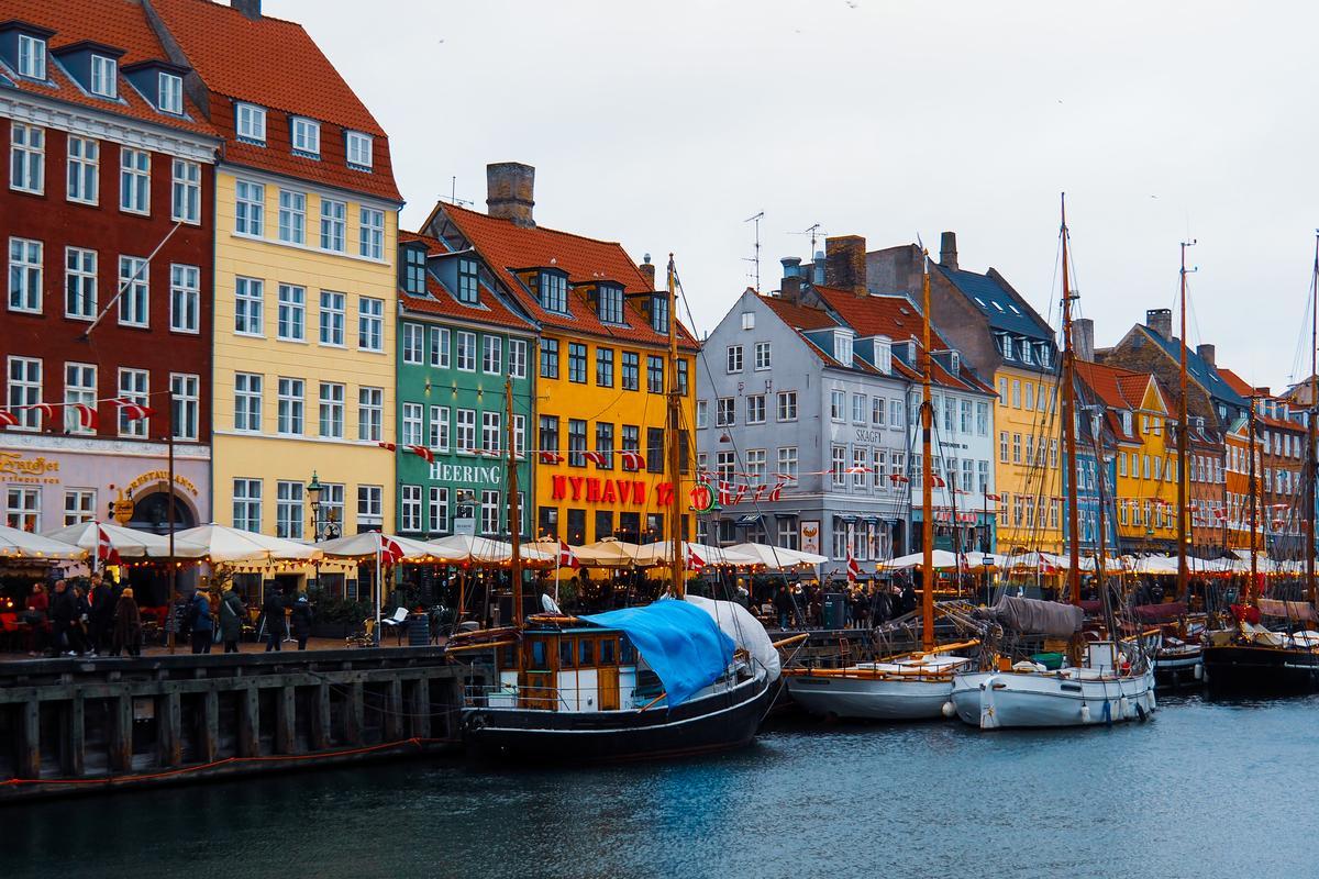 Colorful Nyhavn canal with historic houses and ships in Copenhagen