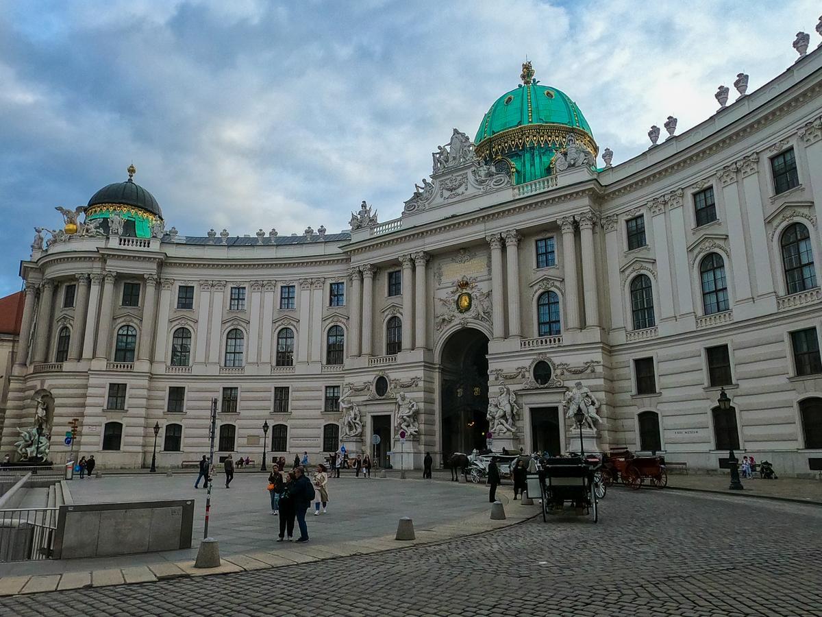 Historic Hofburg Palace Vienna with ornate sculptures and dome