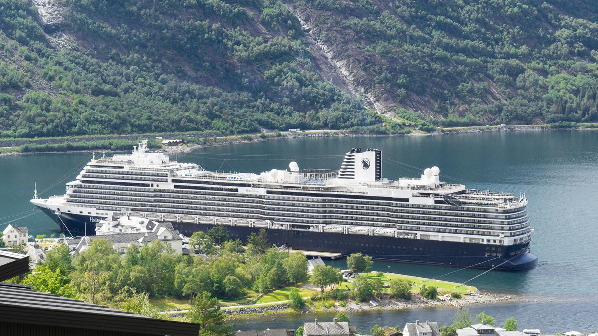 Holland America cruise ship docked in Eidfjord, Norway, stunning fjord landscape in background