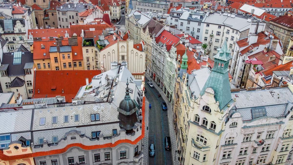 Aerial view of Prague's historic Jewish Quarter showcasing Gothic, Baroque, and Art Nouveau architecture