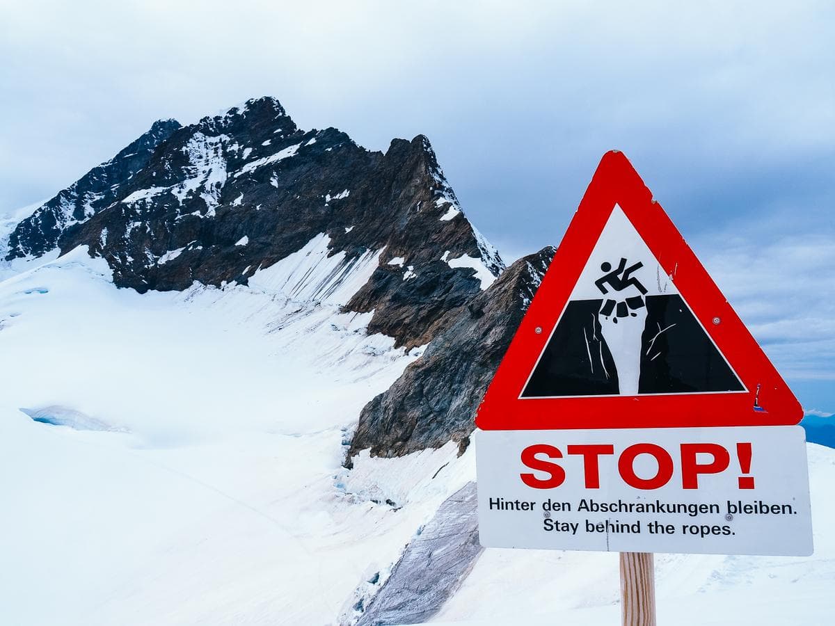 Caution sign at Jungfrau Summit warning climbers to stay behind ropes