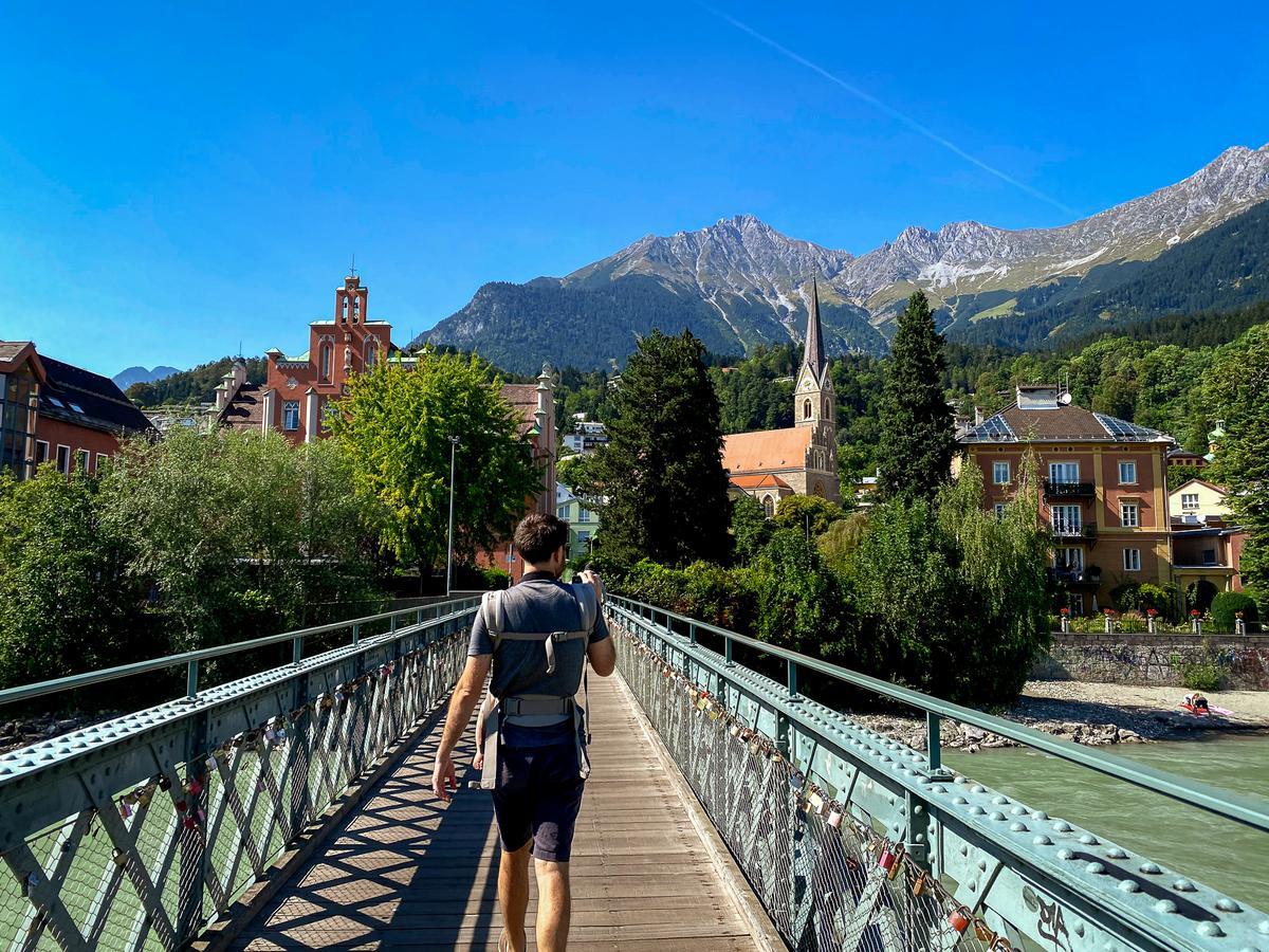 Kyle Kroeger, Author of Things to Do in Innsbruck strolling on Love Lock Bridge