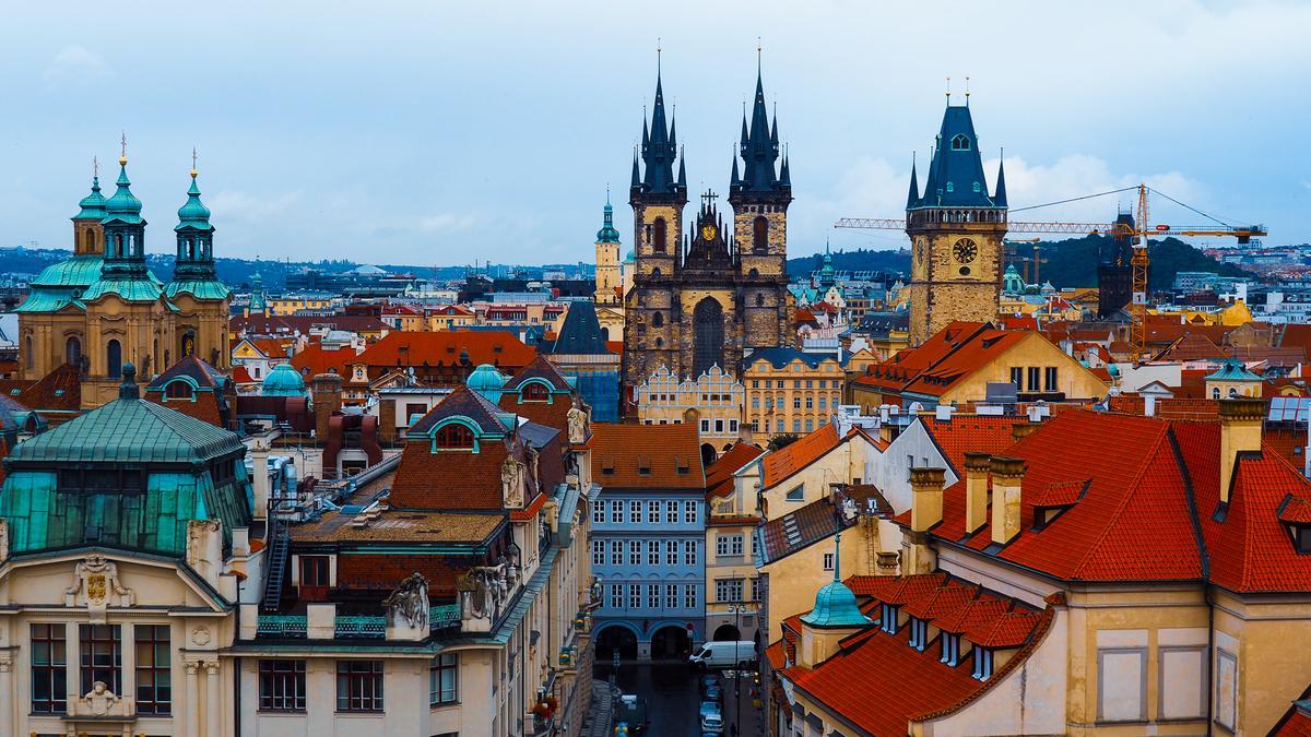 Majestic View of Church of Our Lady before Týn in Prague's Skyline - Gothic spires and historic architecture.