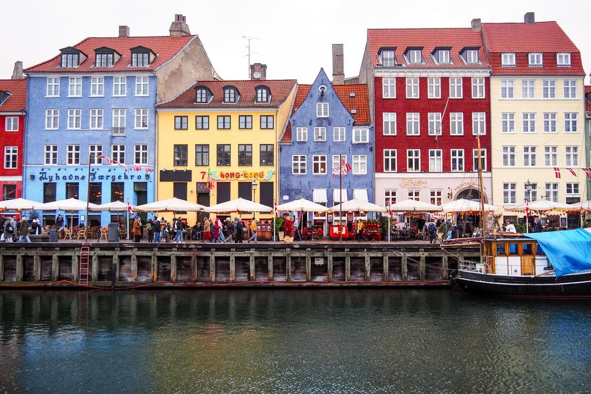 Picturesque Nyhavn waterfront with colorful facades and boats in Copenhagen