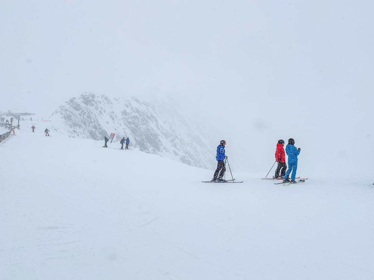 Skiers enjoying Alpine skiing at Stubai Glacier, Austria.