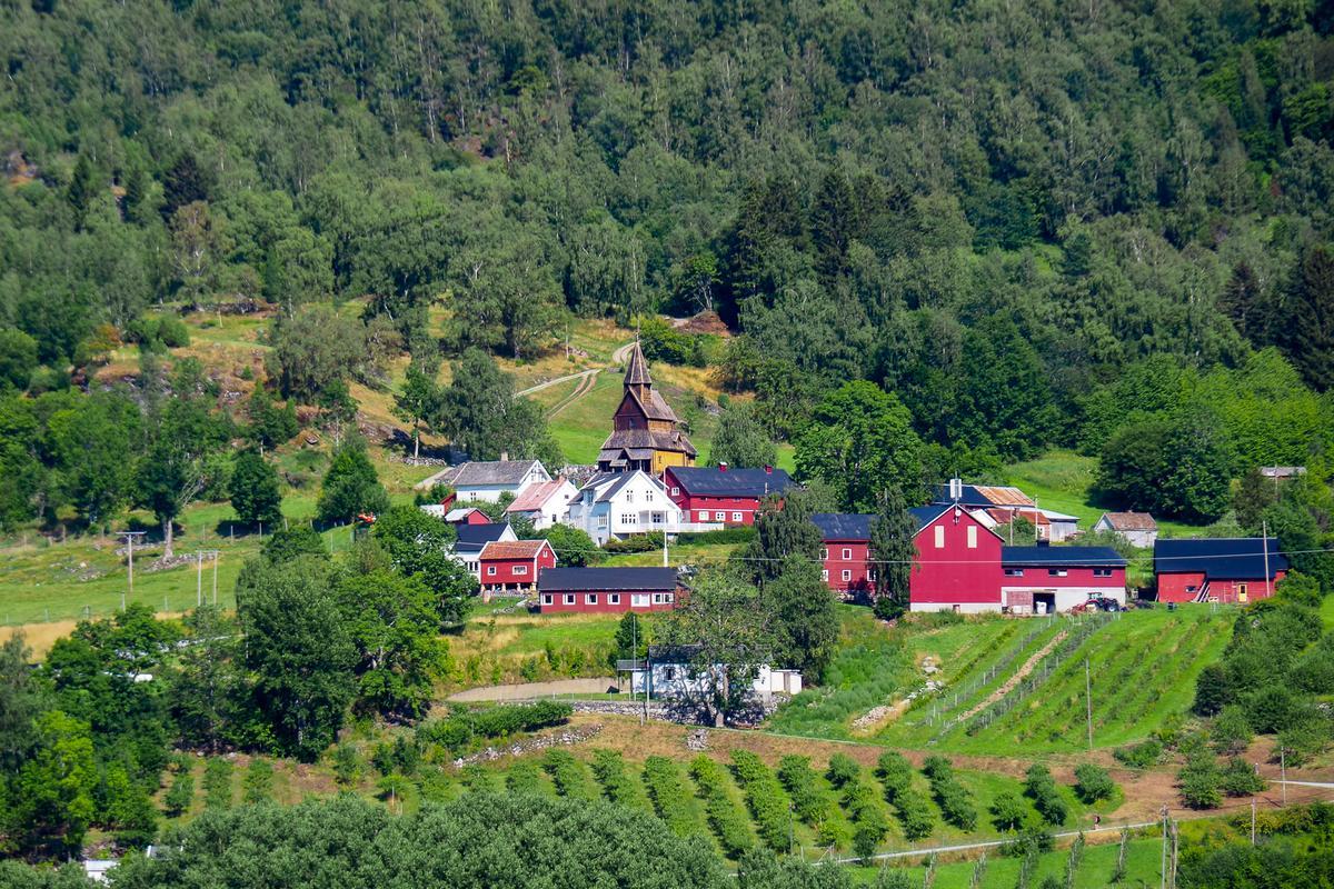 Urnes Stave Church exterior in lush Norwegian countryside, UNESCO World Heritage Site