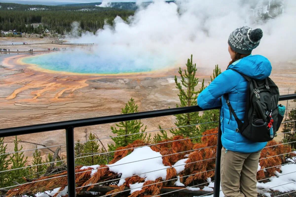 Tourist in Grand Prismatic Spring, Yellowstone National Park during Winter