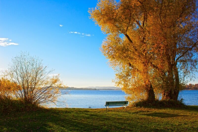 Lake Chiemsee with boats and the Bavarian Alps on the horizon