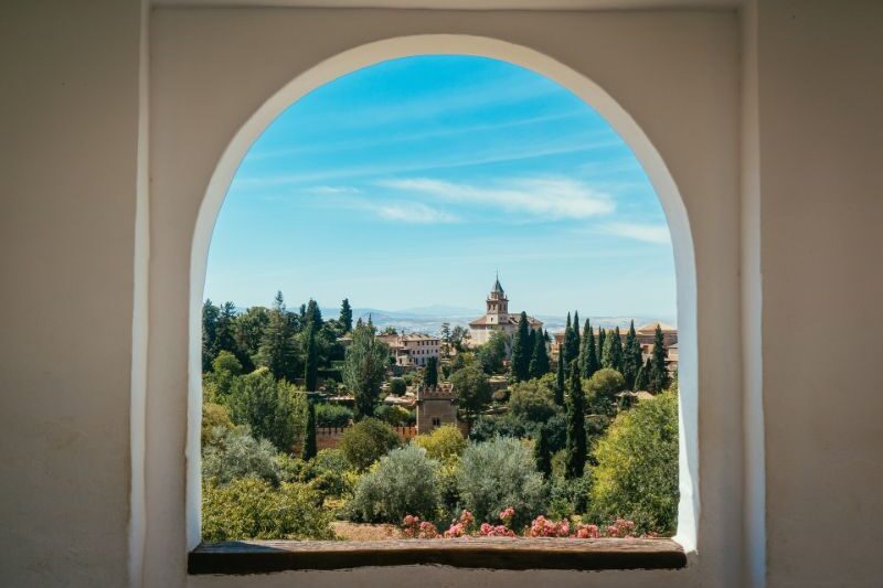 Alhambra Palace and Gardens in Granada, Spain - Historic Moorish architecture and beautiful landscaped gardens.