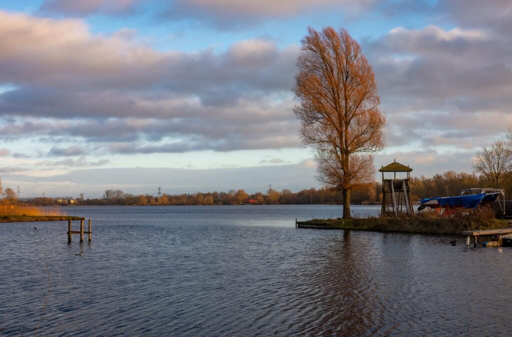 Sunset reflected across Gaasperplas lake in Amsterdam-Zuidoost