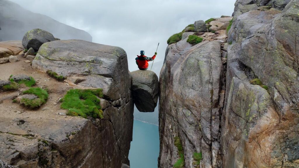 Balancing on Kjeragbolten in Norway