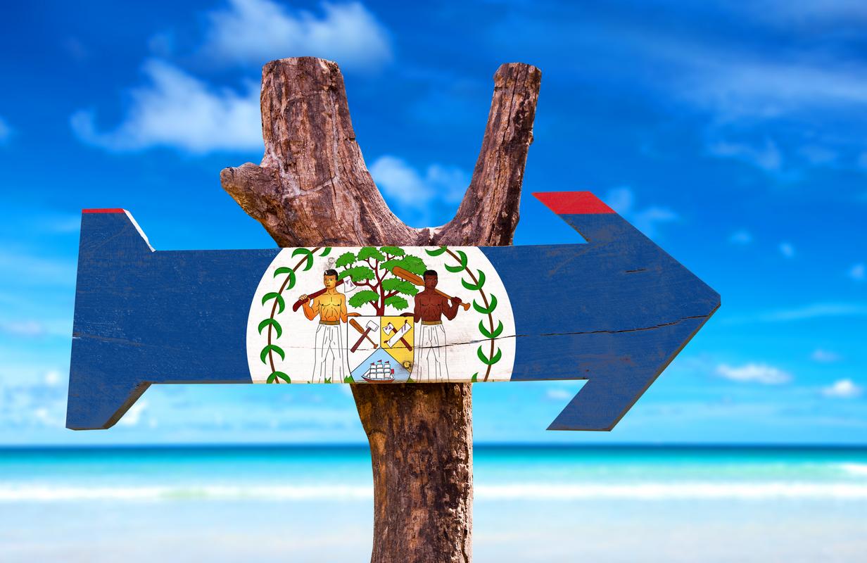 Belize flag beach sign advertising Great Blue Hole tours