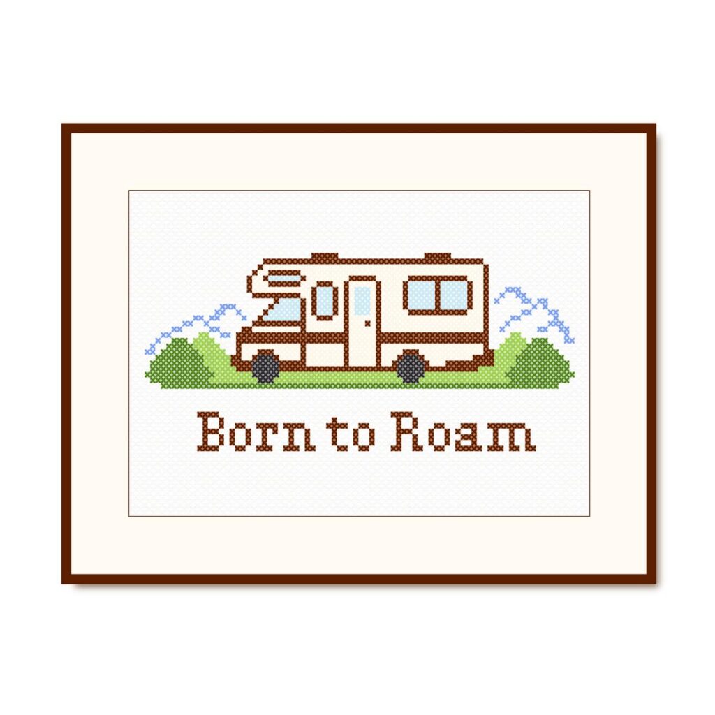Handcrafted cross stitch artwork featuring RV with Born to Roam quote