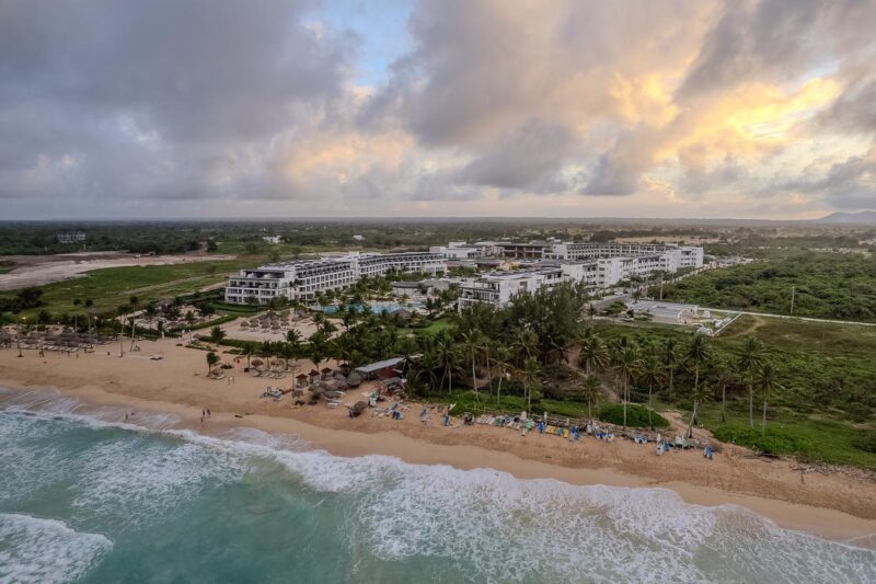 Aerial view of Dreams Macao Beach Punta Cana resort, infinity pool, and pristine Caribbean shoreline