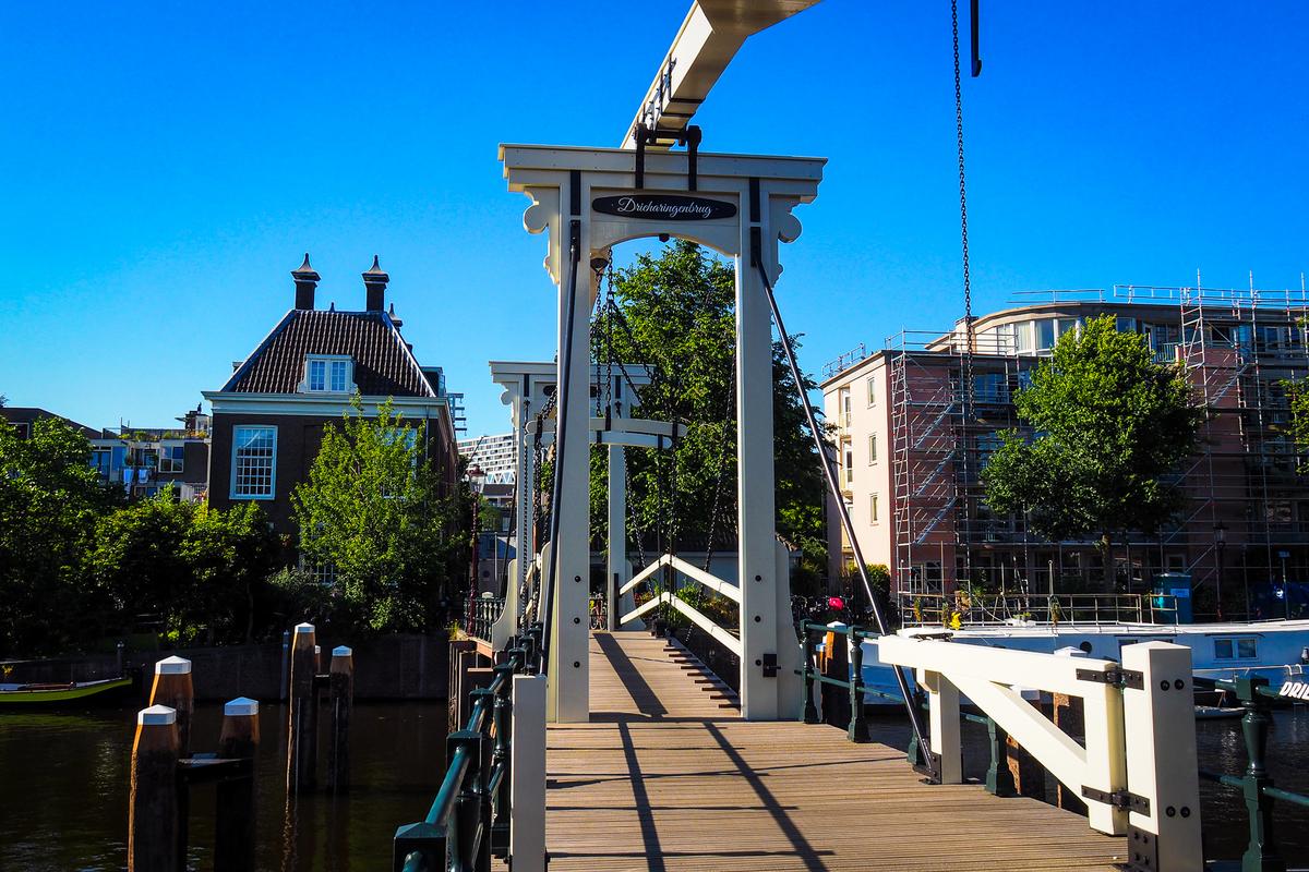 Picturesque Drieharingenbrug drawbridge over Prinseneiland canal in Amsterdam, Netherlands