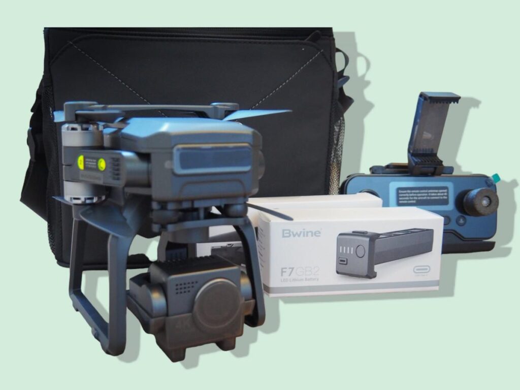 Professional drone photography setup with accessories and carrying case.