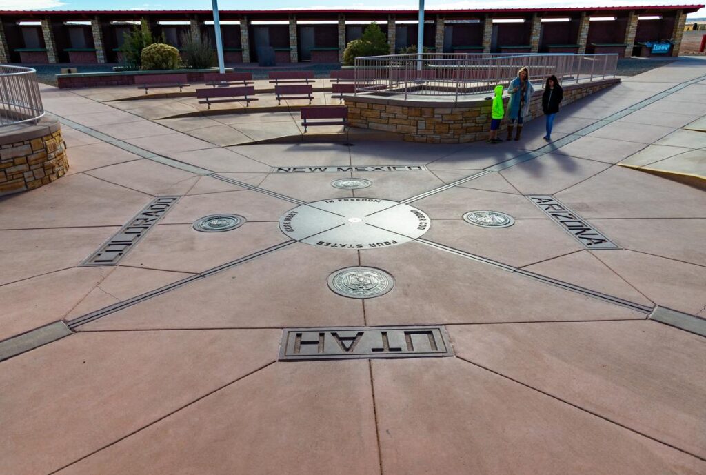 Visitors waiting to take photographs at the Four Corners Monument marker