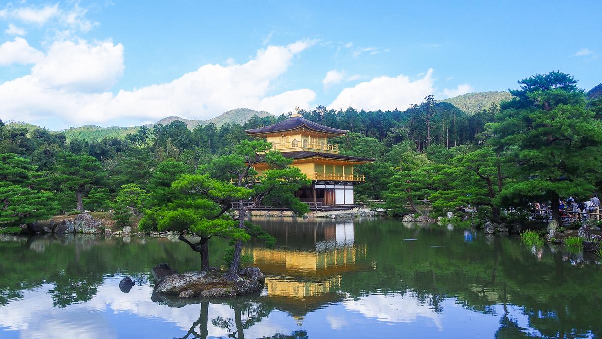 Stunning view of the Golden Pavilion of Kinkaku-ji amidst serene Kyoto landscape