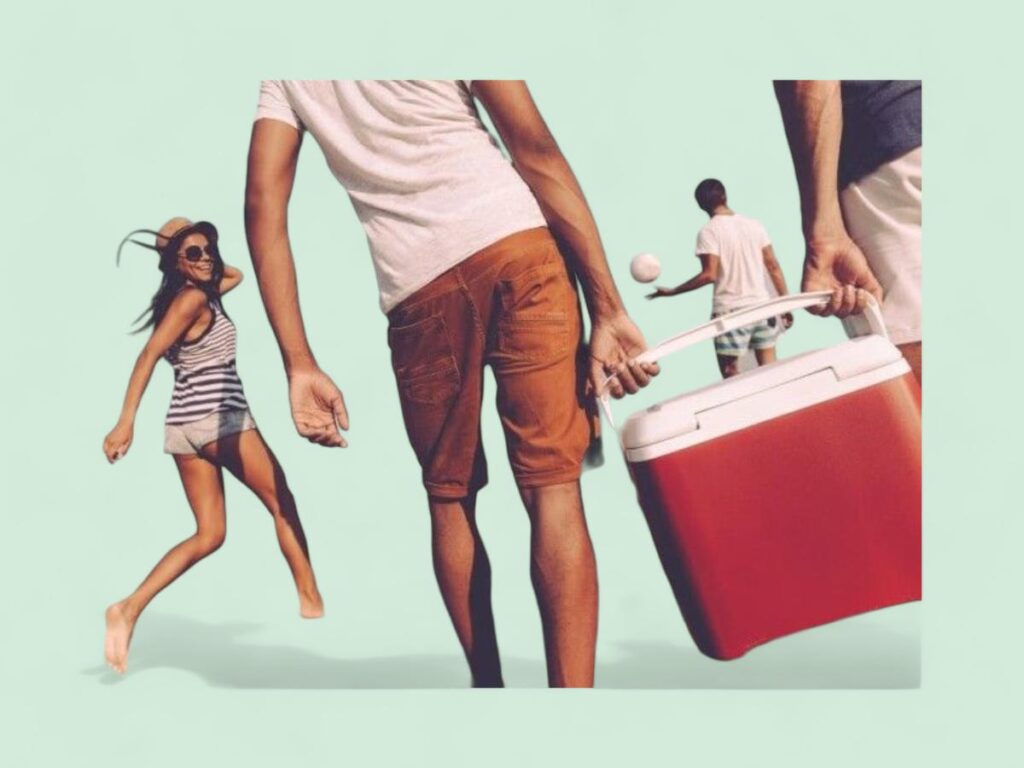 Group of young people holding a cooler by the beach-green.jpg