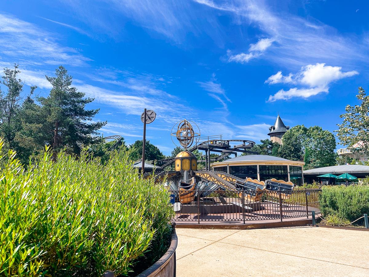 Family enjoying kids' rides and outdoor activities at Jardin d'Acclimatation, Paris
