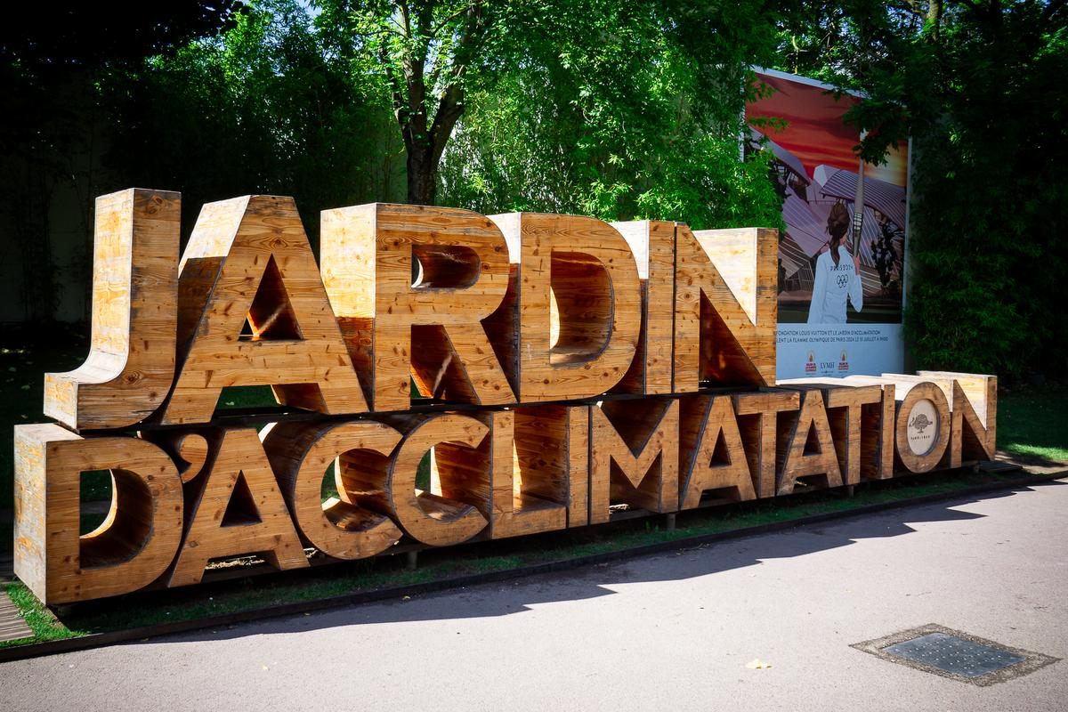 Entrance sign to Jardin d'Acclimatation, family-friendly amusement park and garden in Paris