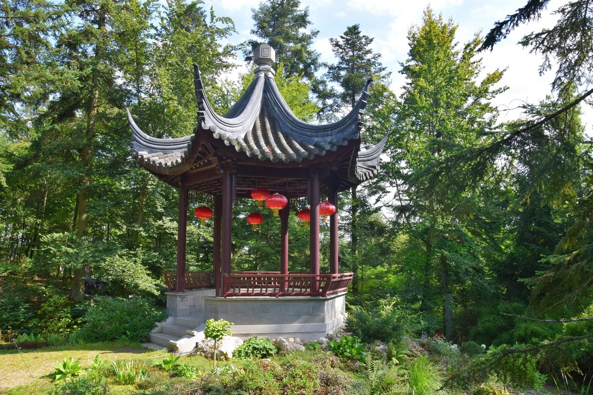 Traditional Nepal Himalaya Pavilion with red lanterns nestled in Bavarian forest