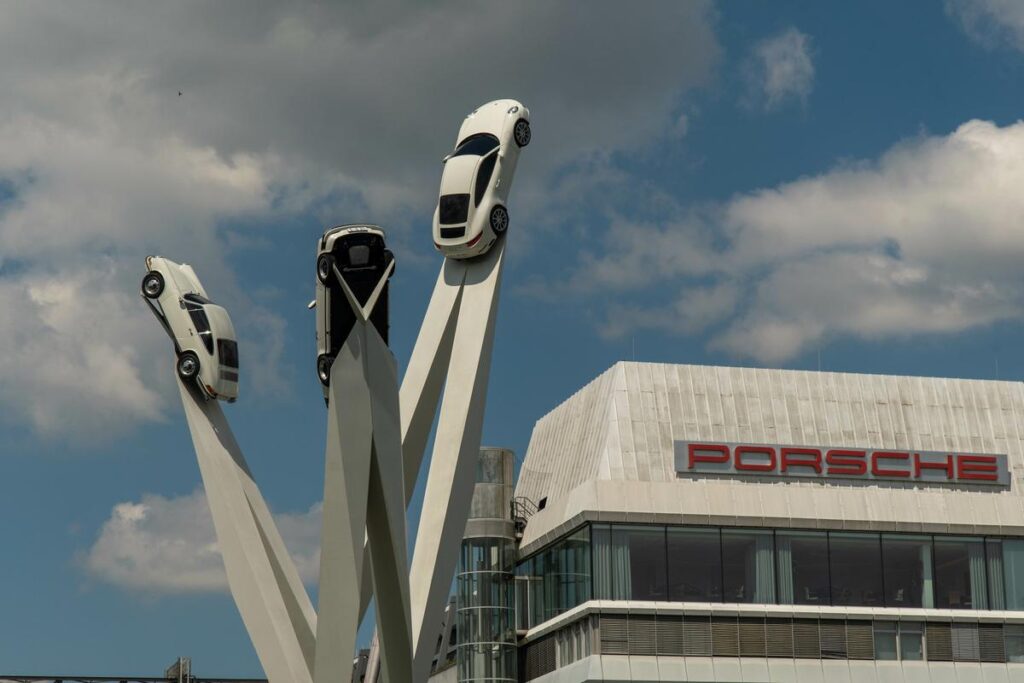 Porsche Museum Stuttgart exterior with car sculpture under blue sky