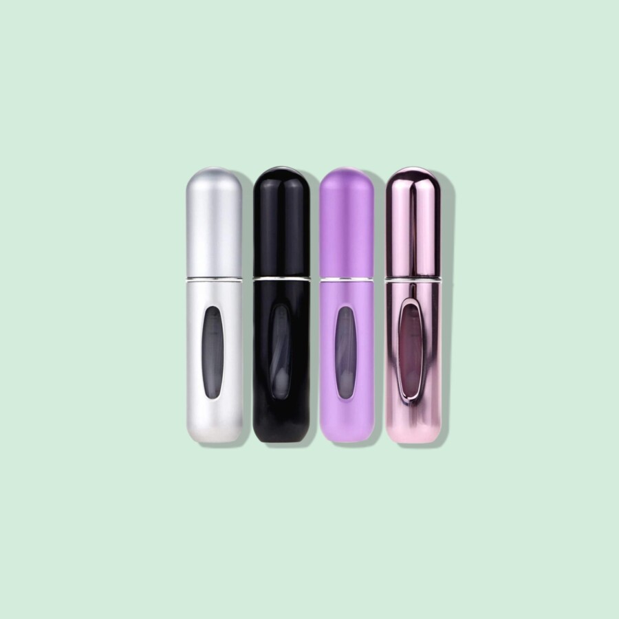 Skogfre Mini Refillable Perfume Atomizer Bottle On Green Background