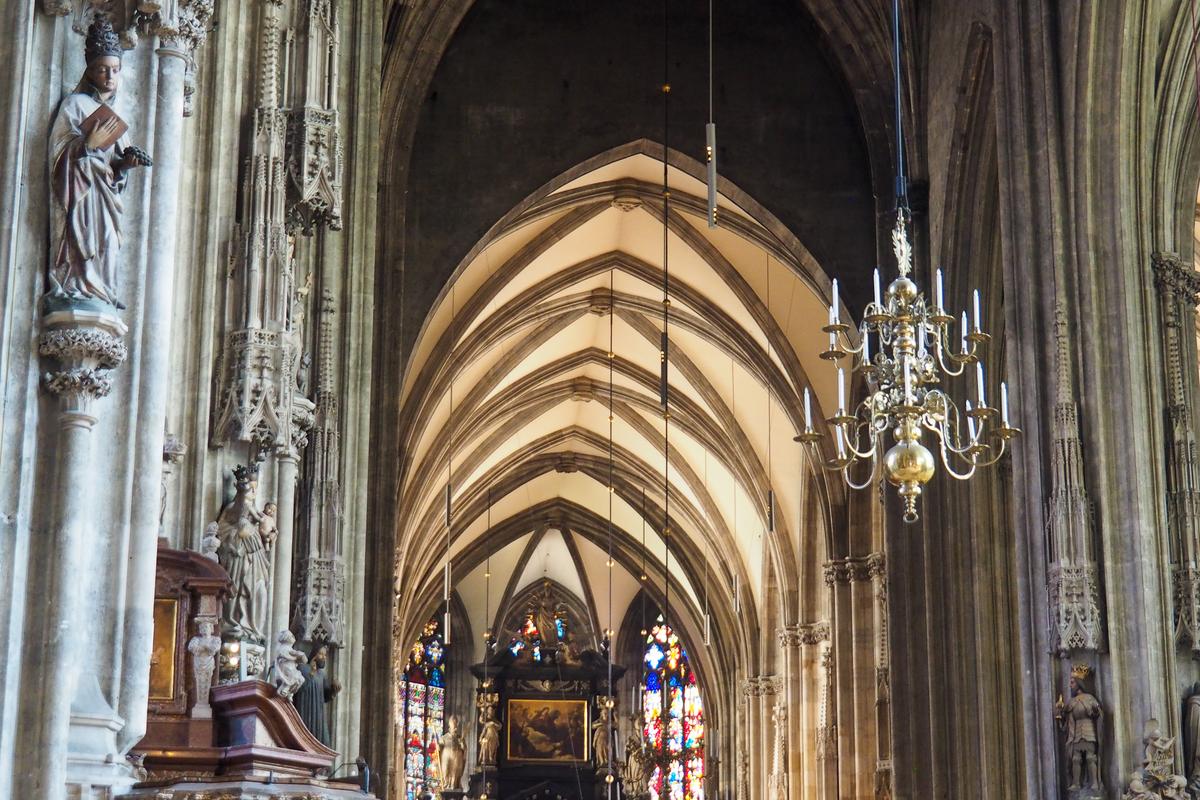 Gothic interior of St. Stephen's Cathedral, Vienna with intricate architecture and stained glass windows