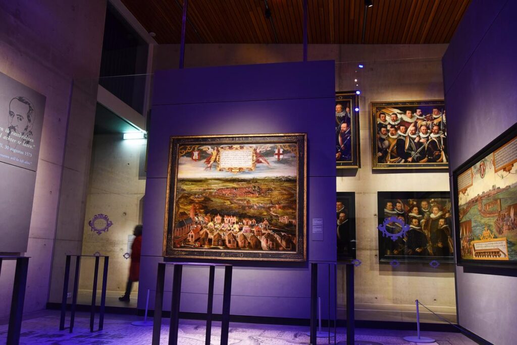 Interior view of Stedelijk Museum Alkmaar with historical paintings and cultural artifacts display.