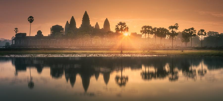 Sunrise over Angkor Wat reflected in the pond in Siem Reap, Cambodia