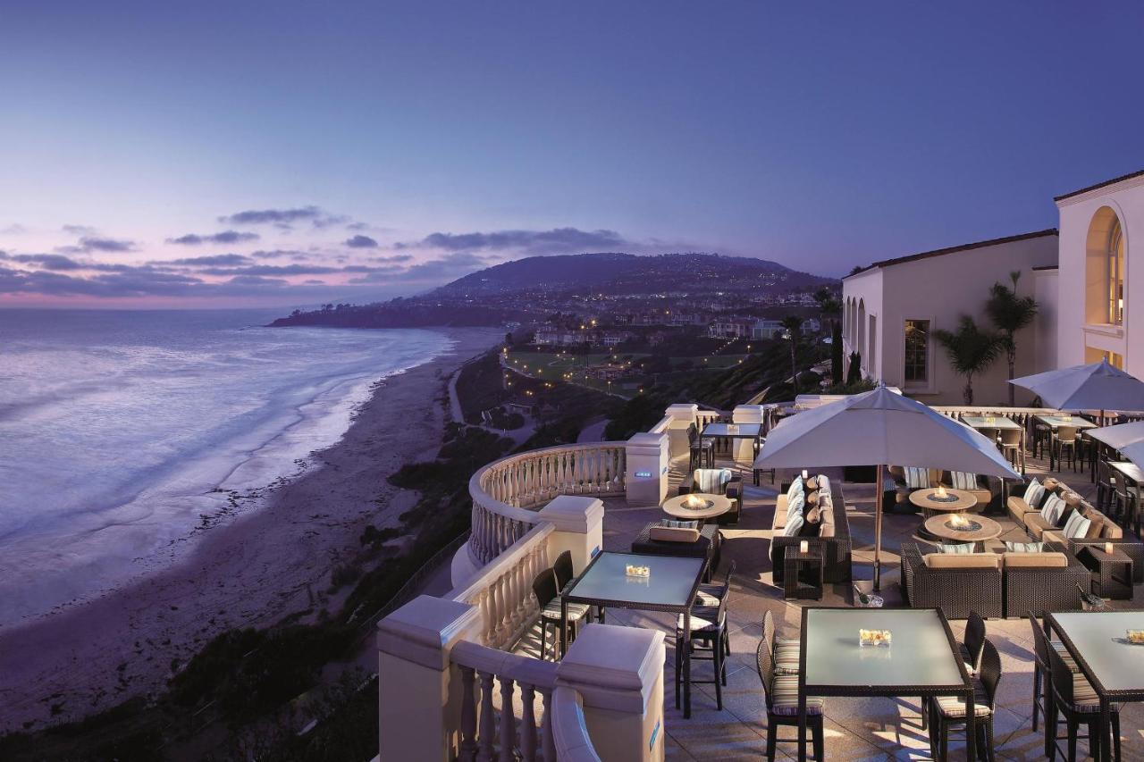 Luxurious cliffside restaurant overlooking the ocean at dusk at The Ritz-Carlton Laguna Niguel
