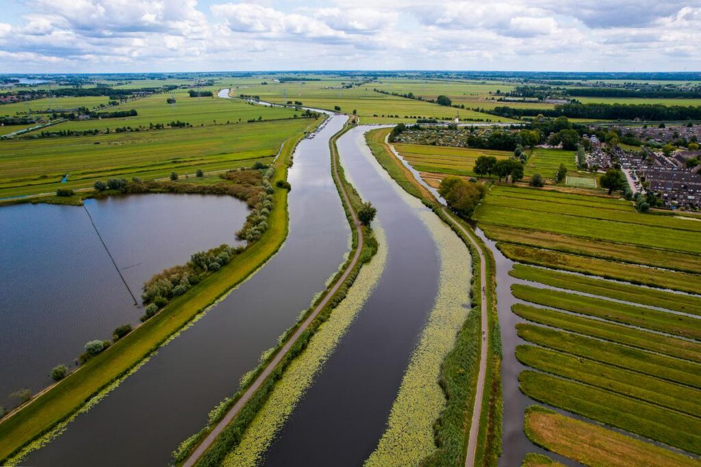 Aerial view of Kinderdijk waterways, Netherlands - UNESCO World Heritage Site landscape.