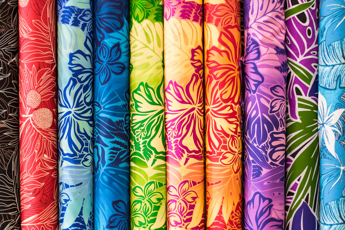 Rainbow Aloha Hawaiian Print Fabric on sale at the Swap Meet on Oahu, showing tropical hawaiian concept