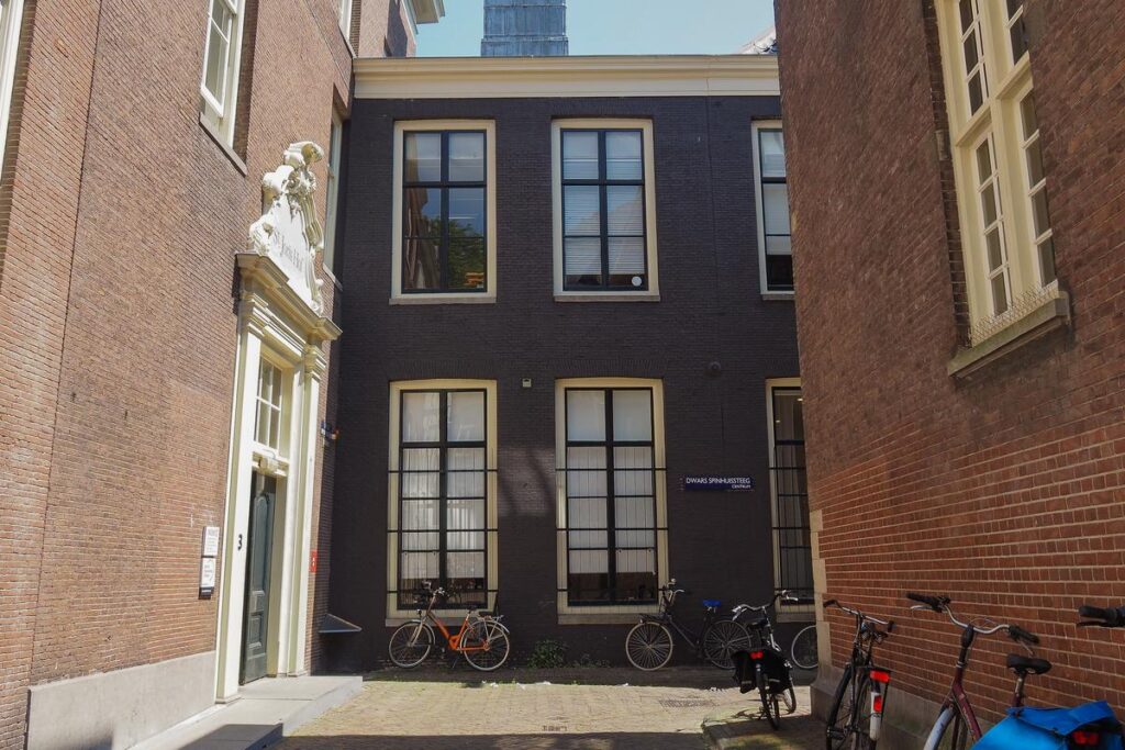 Amsterdam alley with traditional architecture and bikes