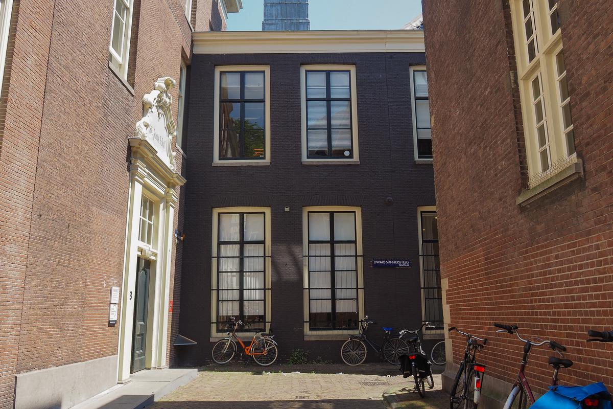 Amsterdam alley with traditional architecture and bikes