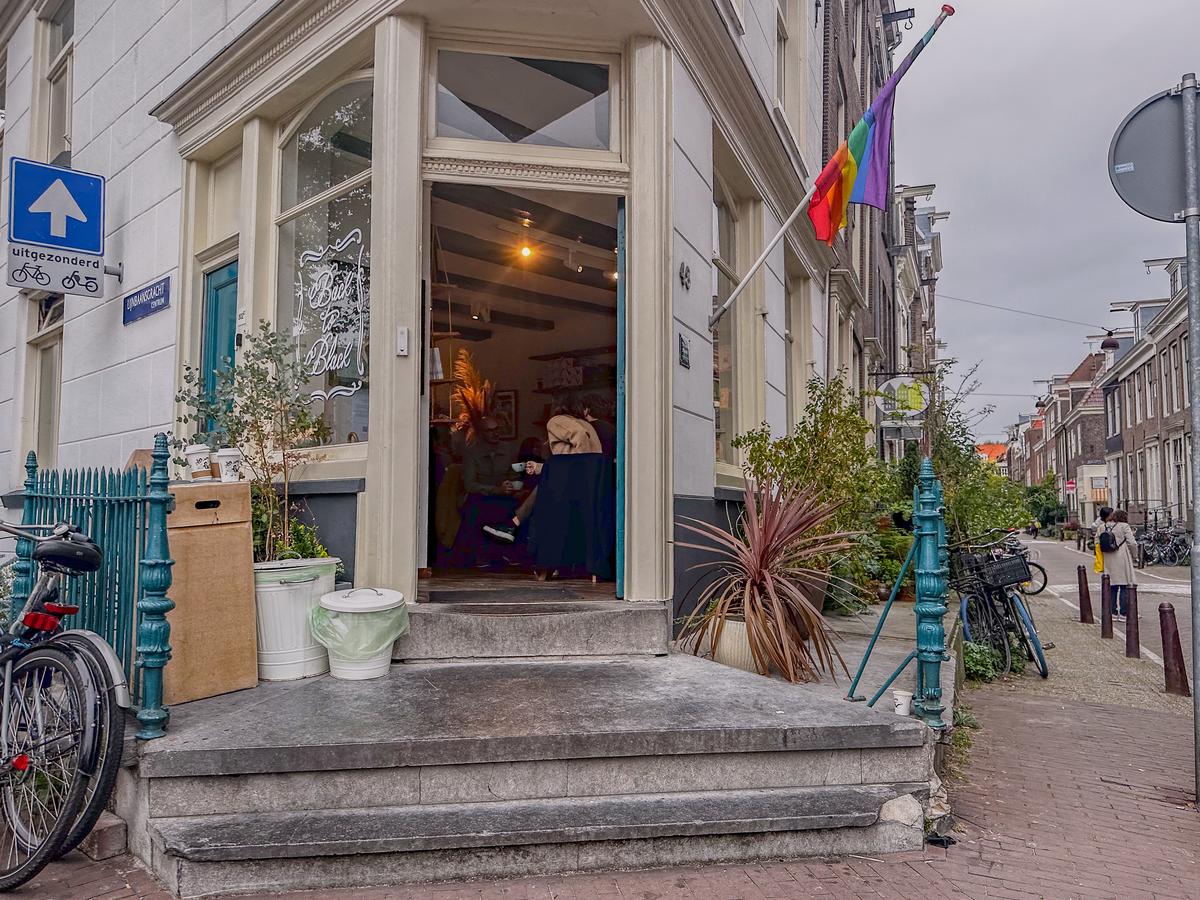 Back to Black coffee shop entrance in Amsterdam with pride flag