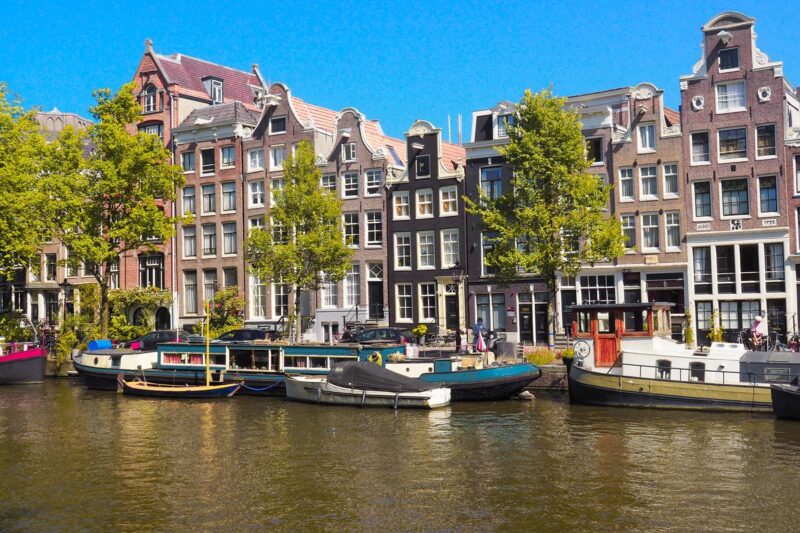 Amsterdam's historic canal-side architecture and houseboats