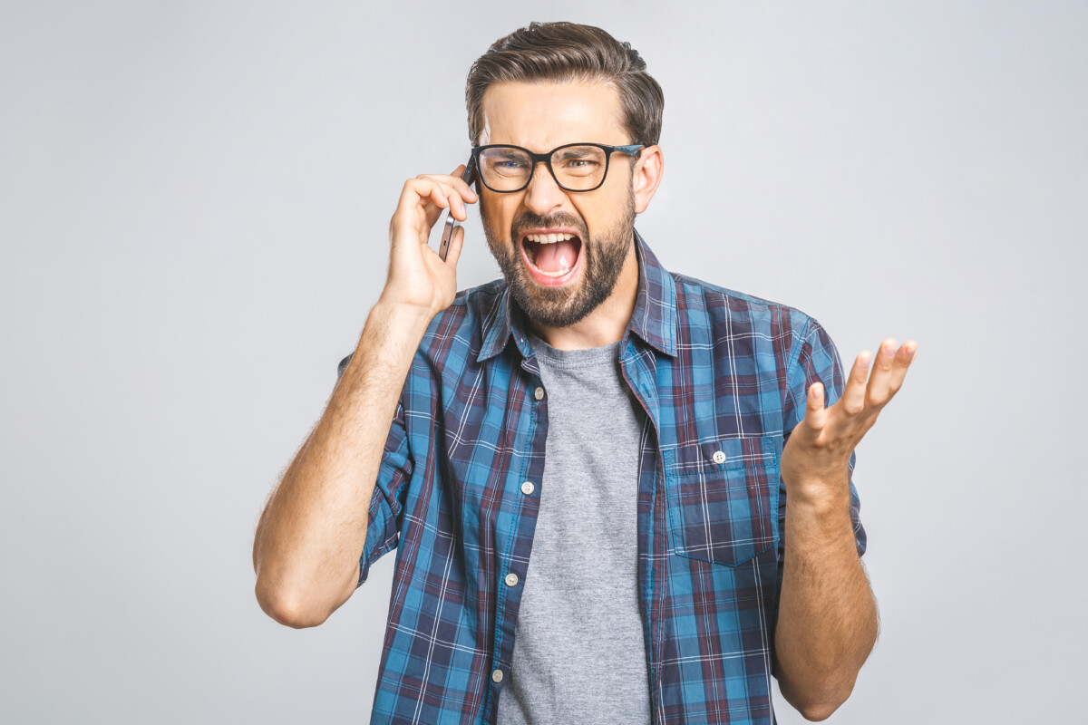Angry Man Cursing on the Phone