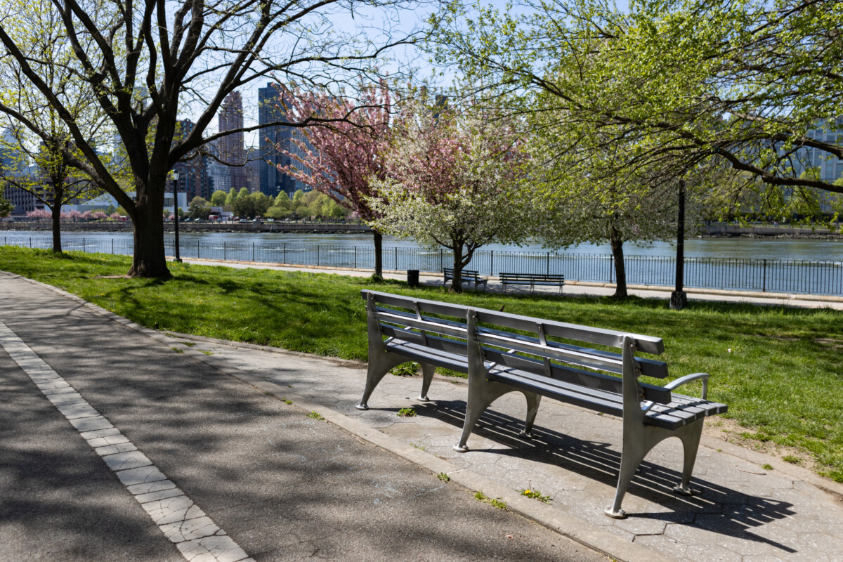 Pathway and bench at the Astoria Park in Queens , New York