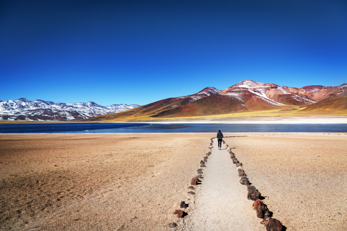 Tourist walking and exploring the views of Atacama Desert in Chile