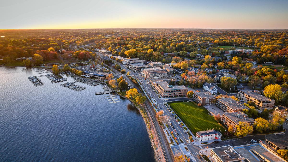 Autumn Sunset Over Wayzata, MN - Aerial photograph of fall foliage and serene Lake Minnetonka during golden hour