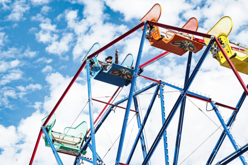 Two riders enjoying the view from the Balboa Fun Zone Ferry Wheel